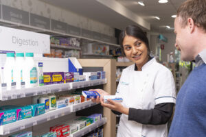 Pharmacist Krishna providing advice to a customer.